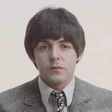 Definitely Paul McCartney. His vocals in Lovely Rita are similar to it. The backgrounds are clearly John.