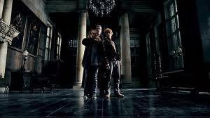 When held hostage at Malfoy Manor what is the name of the death eater who is torturing Hermione as she believes Hermione has broken into her vault at Gringotts?