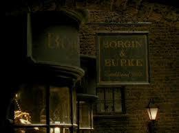 When Harry,Ron and Hermione tail Draco Malfoy and his mother to Borgin and Burkes in Harry Potter and the Half Blood Prince what is the name of the death eater who was keeping watch for them?