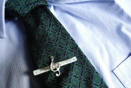 What is the purpose of a tie clip?
