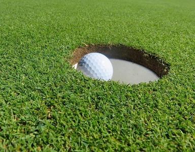How many holes are typically played in a full round of golf?