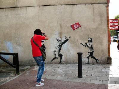 Which documentary film explores the life and work of street artist Banksy?