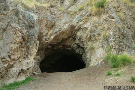 After fighting the orcs, you find a mysterious cave. The entrance is dark, so you don't know what might be in there. What do you do?