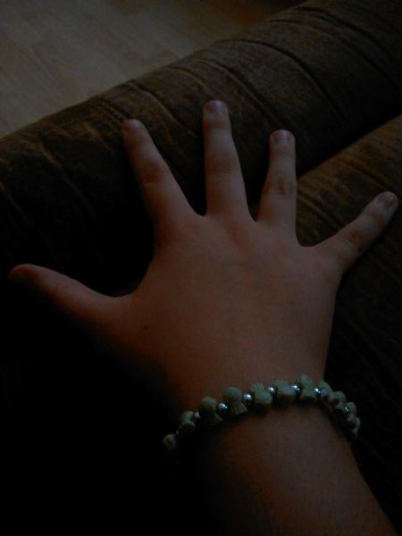 The friendship bracelet Tharyn gave to me. Green means Balance.