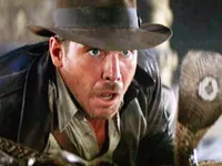 Indiana Jones (first appearing in Raiders of the Lost Ark. The franchise was rebooted many times always starting Harrison Ford) Indiana Jones (first appearing in Raiders of the Lost Ark. The franchise was rebooted many times always starting Harrison Ford)