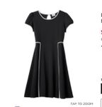 What to wear with this black dress? Since it's still cold, I want to wear maybe a shirt under it or a jacket. I have gray leggings, black leggings, black boots. What color shirt should I wear under it or what jacket? Picture of the dress- http://mobile.kohls.com/product/prd-2057674/disney-d-signed-pique-fit-flare-dress-girls-7-16.jsp What to wear with this black dress? Since it's still cold, I want to wear maybe a shirt under it or a jacket. I have gray leggings, black leggings, black boots. What color shirt should I wear under it or what jacket? Picture of the dress- http://mobile.kohls.com/product/prd-2057674/disney-d-signed-pique-fit-flare-dress-girls-7-16.jsp