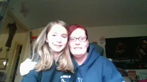 me my mom and the poster in the background ready to kill us!