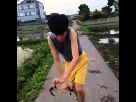 Chinese guy dancing with crabs