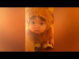 Adorable Toddler Dressed In a Lion Costume Tries To Imitate Ferocious Beast