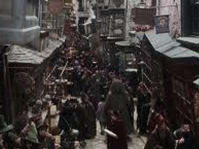 when harry, Ron and hermione are looking out of the window of a certain shop in Diagon alley they see malfoy sneaking of down another alley with his mum,while seeing malfoy do this which of these shops are they in?
