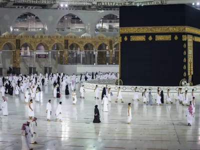 How many times do pilgrims walk around the Kaaba during Tawaf?