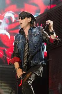 Which famous singer is known for wearing a signature bucket hat?