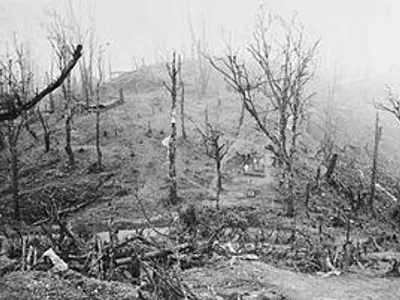 In Burma some British soldiers came across 3 Burmese men and a boy. The British soldiers knew they were spies for the Japanese, and the Officer ordered them to be shot. What did one of the soldiers who were part of the firing squad do?