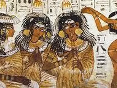 If you're at a ancient Egyptian party and a servant putts a cone on your head, what is it made of?