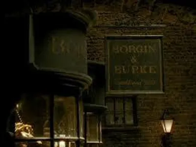 When Harry,Ron and Hermione tail Draco Malfoy and his mother to Borgin and Burkes in Harry Potter and the Half Blood Prince what is the name of the death eater who was keeping watch for them?