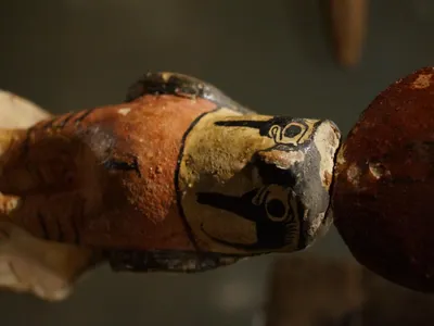 Which god was depicted with the head of a falcon?
