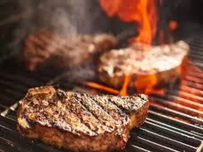 How often should you flip meat while grilling?
