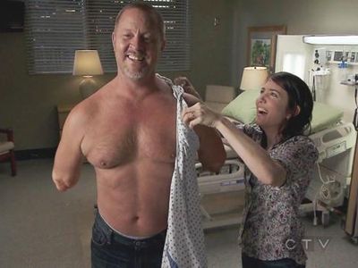 In season 7, the double arm transplant, what is written on the arm.