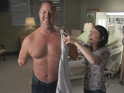 In season 7, the double arm transplant, what is written on the arm.