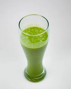 Which fruit is often used as a base for green smoothies?