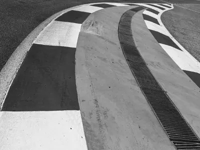 Which race is known for its street circuit near a marina?