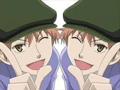 Which side does Kaoru part his hair on most of the time?