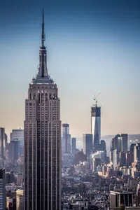 Which architectural style is characterized by its use of exposed steel, glass, and concrete?