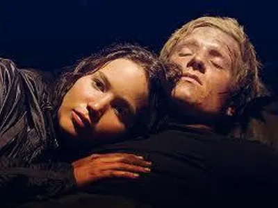 Who almost kills Katniss?