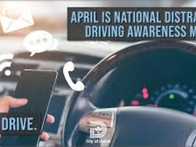Why is it advisable to avoid distractions while driving in city streets?
