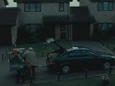 In Harry Potter and the Deathly Hallows Part 1 Harry watch as his family are packing the car getting ready to leave and go into hiding to stay safe in case Voldemort goes after them for information on Harry and his whereabouts, which member of the Dursley family comes up to Harry and shakes his hand before they go?
