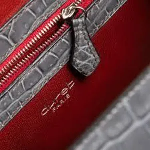 What material is commonly used to make luxury handbags?