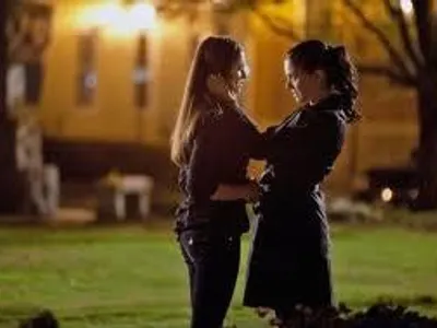 What is the name of Elena's real mom?