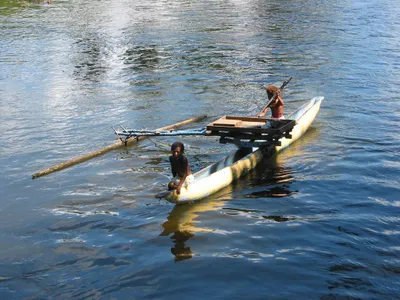 What is the purpose of outriggers on a kayak?