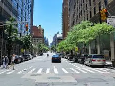 What should you do first when approaching a pedestrian crossing in a city?