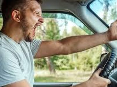 What is a proactive step to take in traffic to handle potential aggression?
