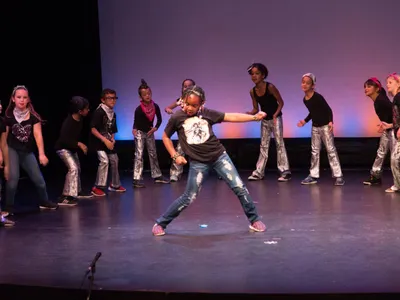 What is the term for a collective of street dancers who perform choreographed routines?