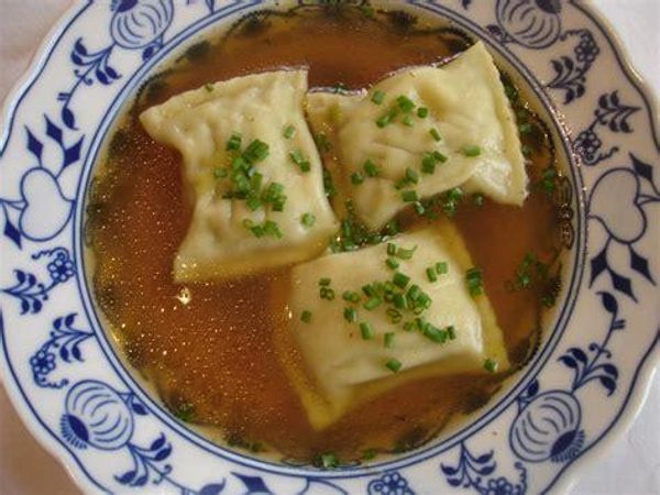 Maultaschen?  “Maultaschen is a traditional German dish that originated in the region of Swabia in Baden-Württemberg. It consists of an outer-layer of pasta dough which encloses a filling traditionally consisting of minced meat, smoked meat, spinach, bread crumbs and onions and flavoured with various herbs and spices (e.g. pepper, parsley and nutmeg). Maultaschen are similar to the Italian ravioli but are typically larger in size—each Maultasche being approximately 8-12 centimeters (3-5 inches) across. They are almost invariably square or rectangular in shape.” Wikipedia.