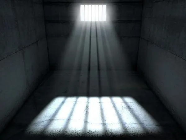You wake up on a cold, stone floor. Looking around, you spot a large iron door with glowing red numbers above it. The numbers read 23:36, and you figured it was a timer, since there was light coming through a small window at the top of wall behind you. You let out a soft grunt as you clutched your head, starting to feel the pain of whatever had to hit you to get you here. You tense up as you hear a groan and the rattle of chains coming from a dark corner of the room.