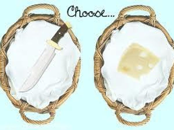On a table there is a knife an a Block of cheese. A voice is telling you to choose, What do you do