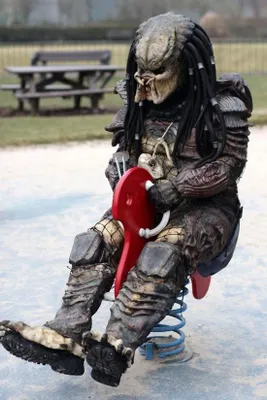 Question about an alien movie Okay, so in the Predator movie series, which movie had the guy in an apartment with a telescope who spots a Predator and kills it in his oven?