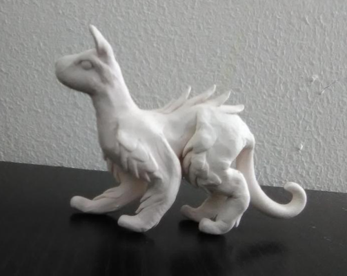 Hey any color suggestions for this sculpture? I made this dog, cat, dragon thing and I don't know what colors to paint it (And yes I know the face is a little, just a little screwed up). Hey any color suggestions for this sculpture? I made this dog, cat, dragon thing and I don't know what colors to paint it (And yes I know the face is a little, just a little screwed up).