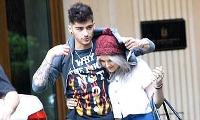 Perrie Edwards covers Zayn Malik's rude T-shirt as she shelters under his hoodie during romantic stroll | Mail Online