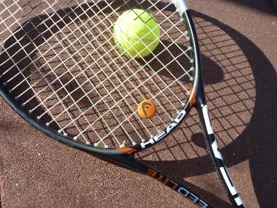 What is the purpose of tennis shock absorbers?