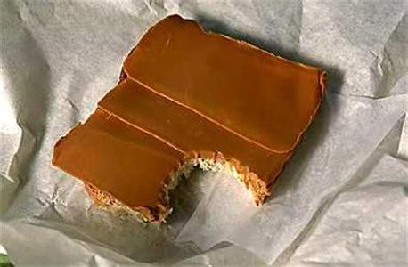 Brunost?  “Brunost is a common, Norwegian name for mysost, a family of cheese-related foods made with whey, milk, and/or cream.” Wikipedia.