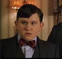 What is the name of the actor who plays the role of Harry's cousin Dudley who is loved very much by his family and gets anything he wants when he wants it throughout the entire Harry Potter series?