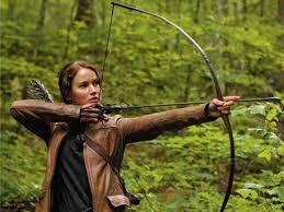 Who does Katniss go Hunting with?