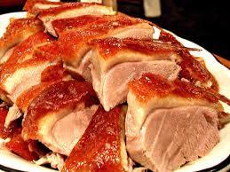 "Peking duck is a dish from Beijing that has been prepared since the imperial era. The meat is characterized by its thin, crisp skin, with authentic versions of the dish serving mostly the skin and little meat, sliced in front of the diners by the cook." Wikipedia.