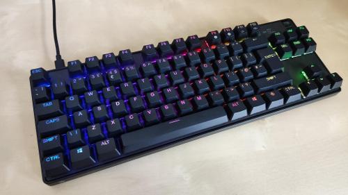 Which type of keyboard design is known for its curved layout?