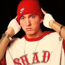 When did Eminem quite school (which grade)? and why?