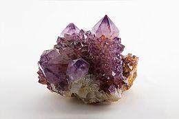Which element gives an amethyst its purple colour?
